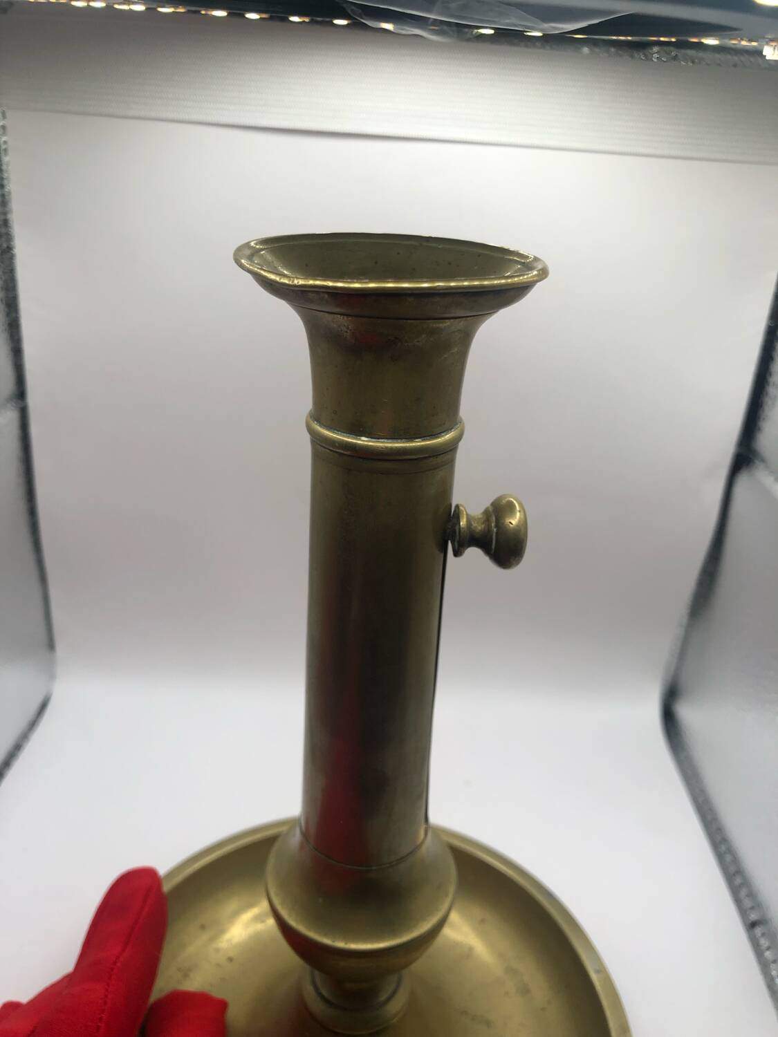 Candle holder with a pusher