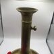 Candle holder with a pusher