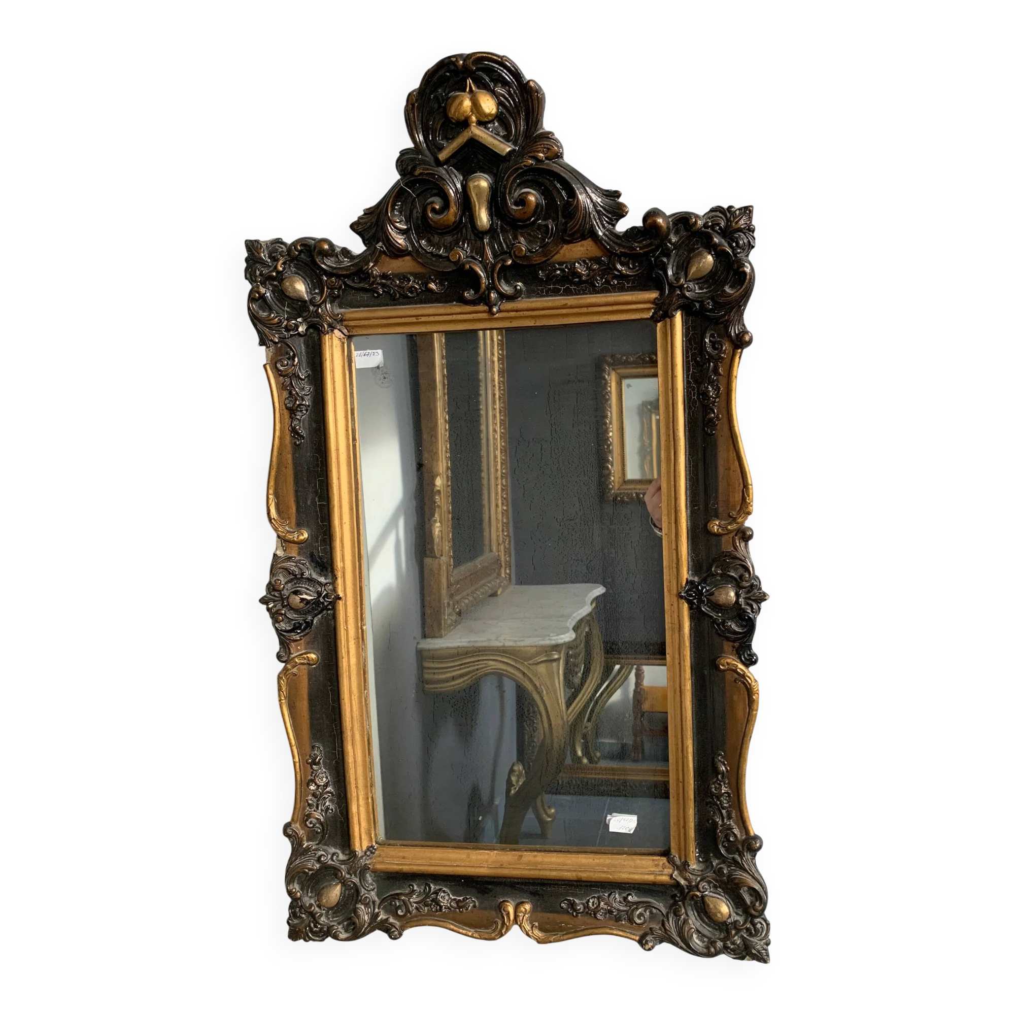 Antique bevelled mirror from the 19th century, sculpted and gilded frame.