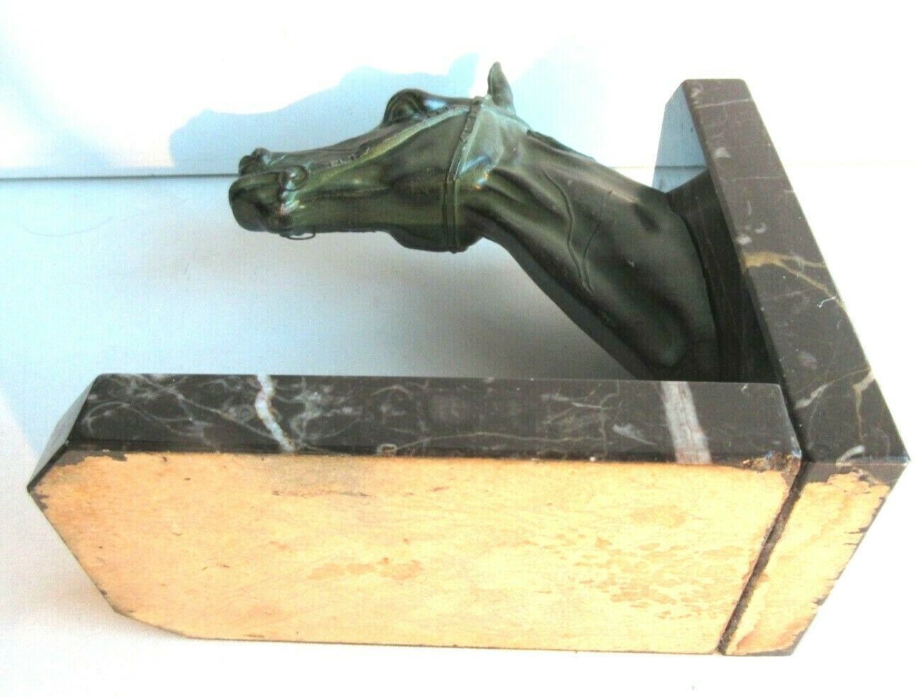 Art-Deco bookend Horse in patinated regulation on black marble support