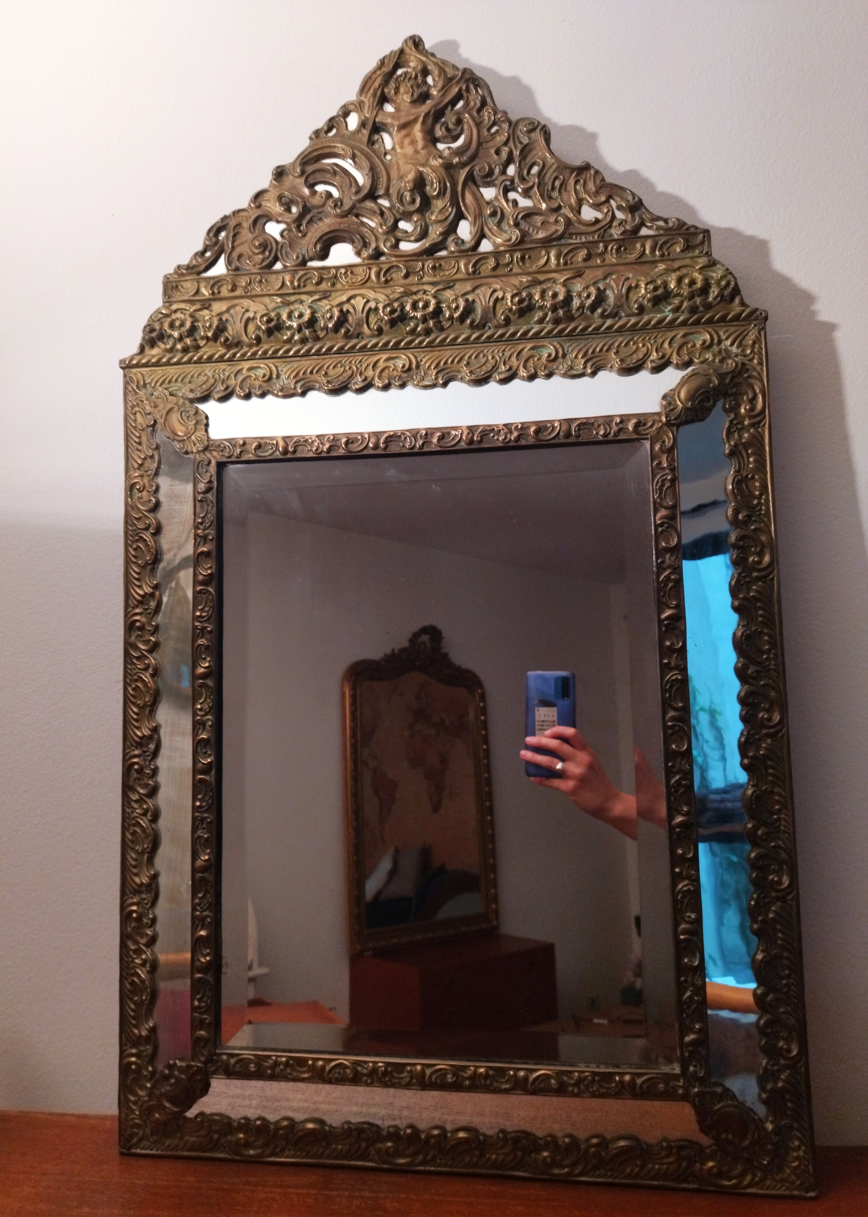 Repelled brass pareclose mirror