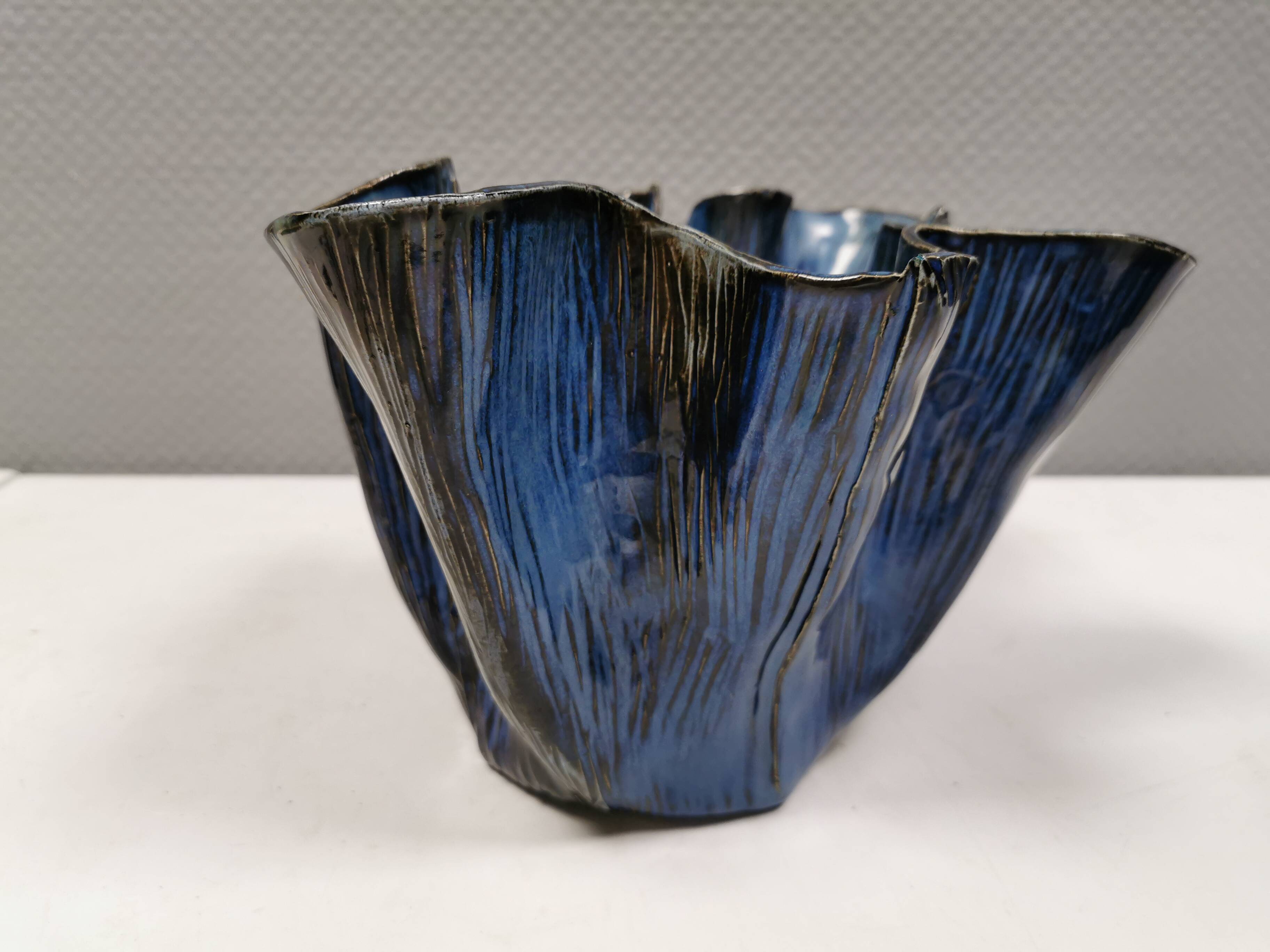 Very special vase in “folded” bluish glazed clay.