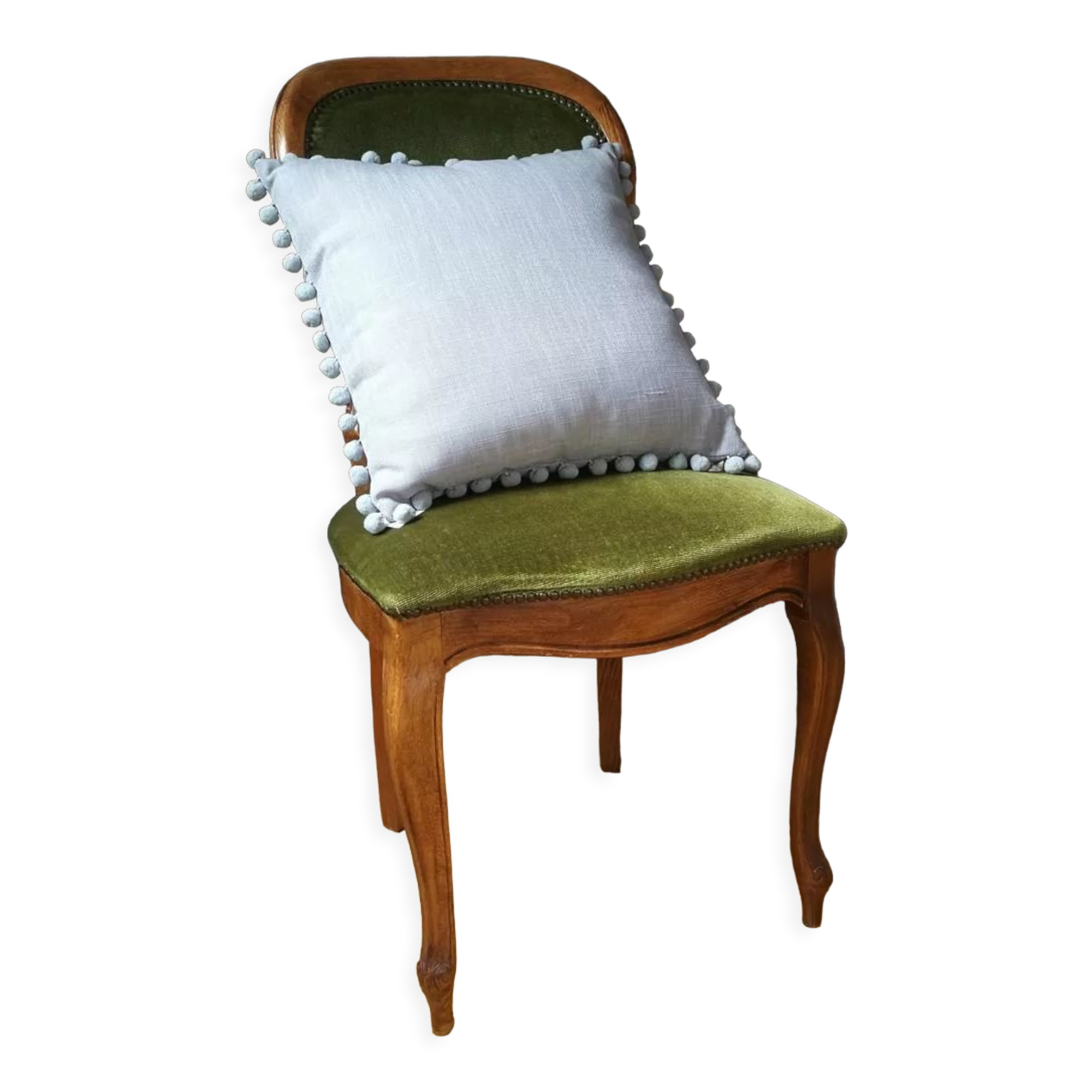 Gray cushion with pompoms