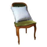 Gray cushion with pompoms