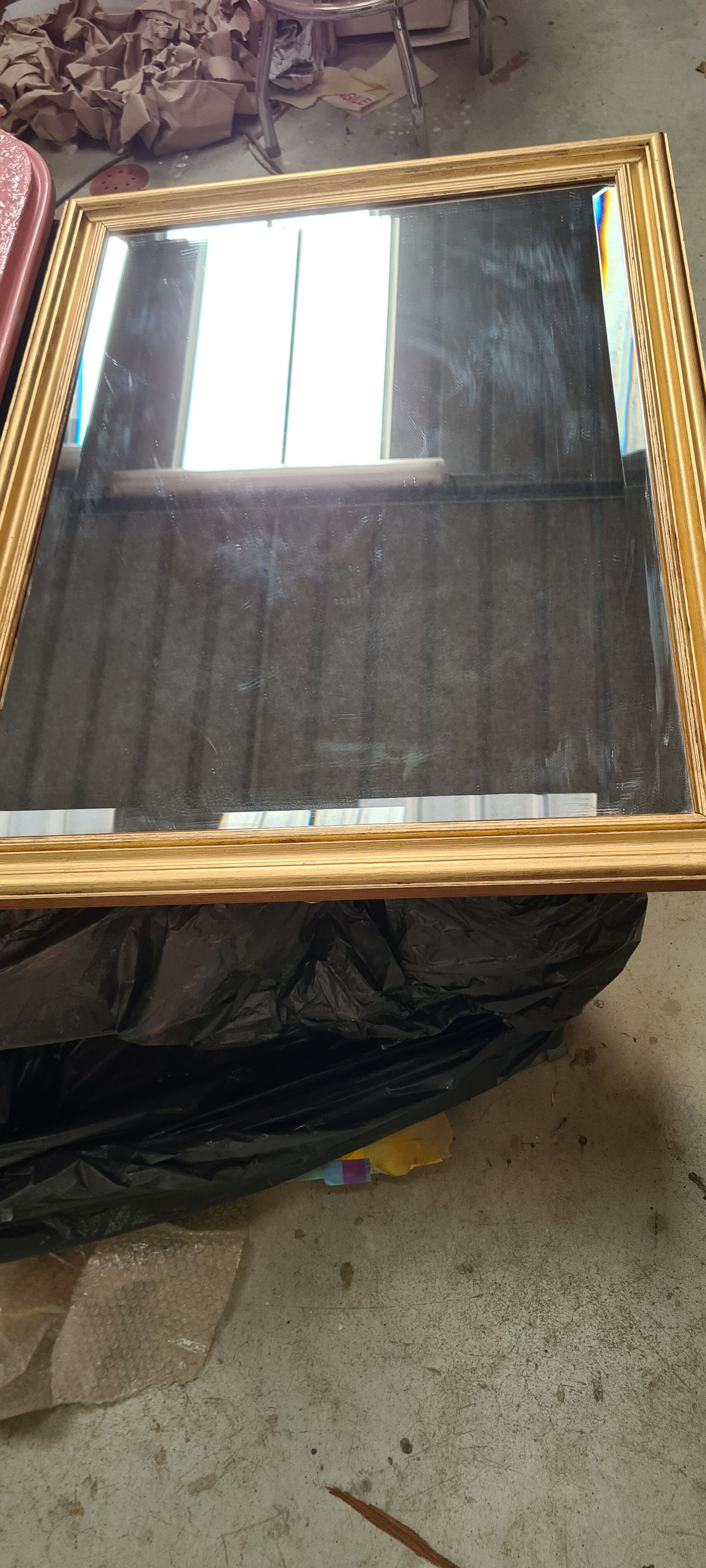 Gilded mirror on wood, 89x59