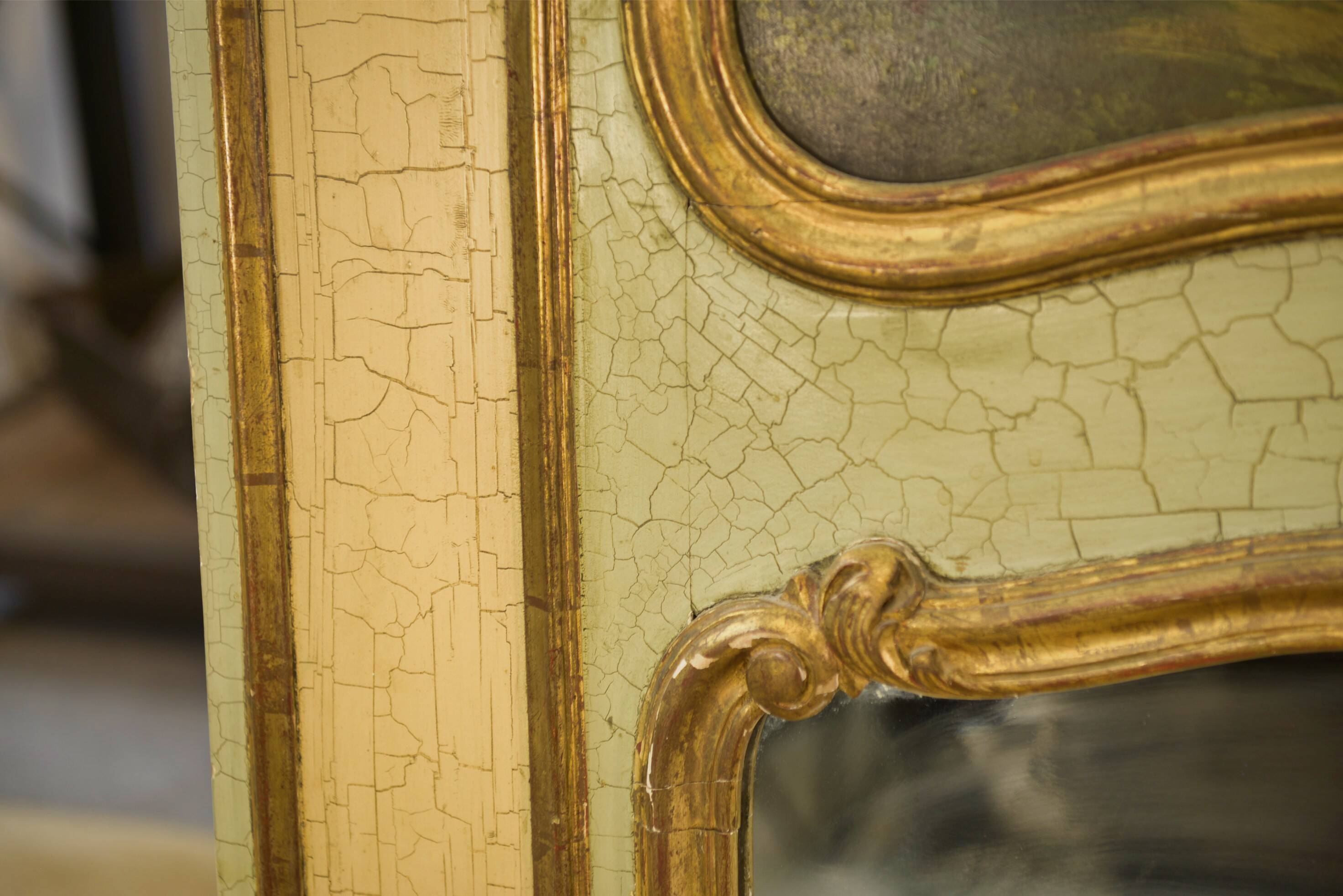 Trumeau mirror with cracked patina and oil on panel depicting a romantic scene from the 19th century.