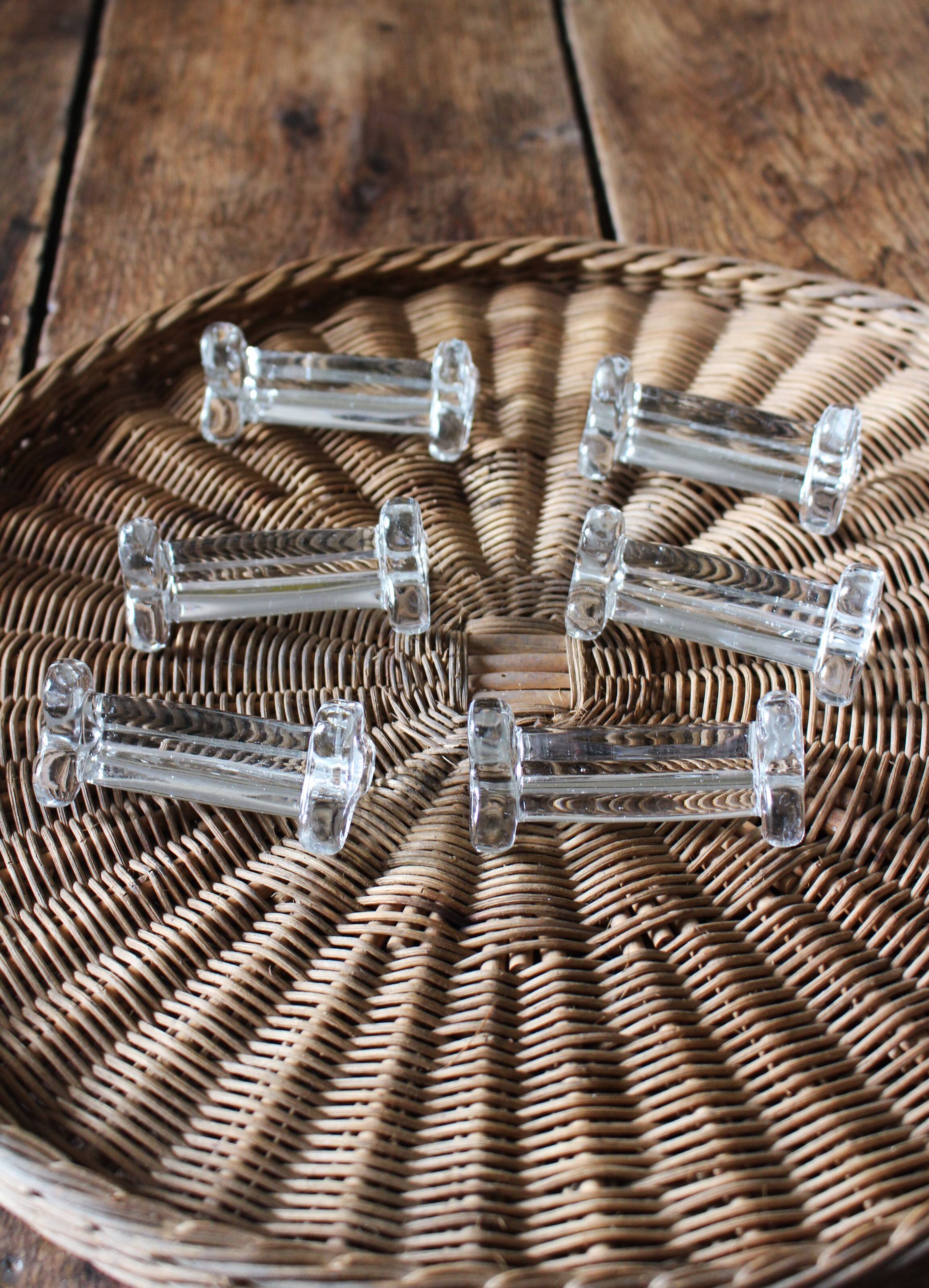 A set of 6 antique transparent trilobed glass knife holders