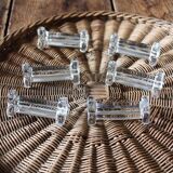 A set of 6 antique transparent trilobed glass knife holders