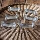 A set of 6 antique transparent trilobed glass knife holders