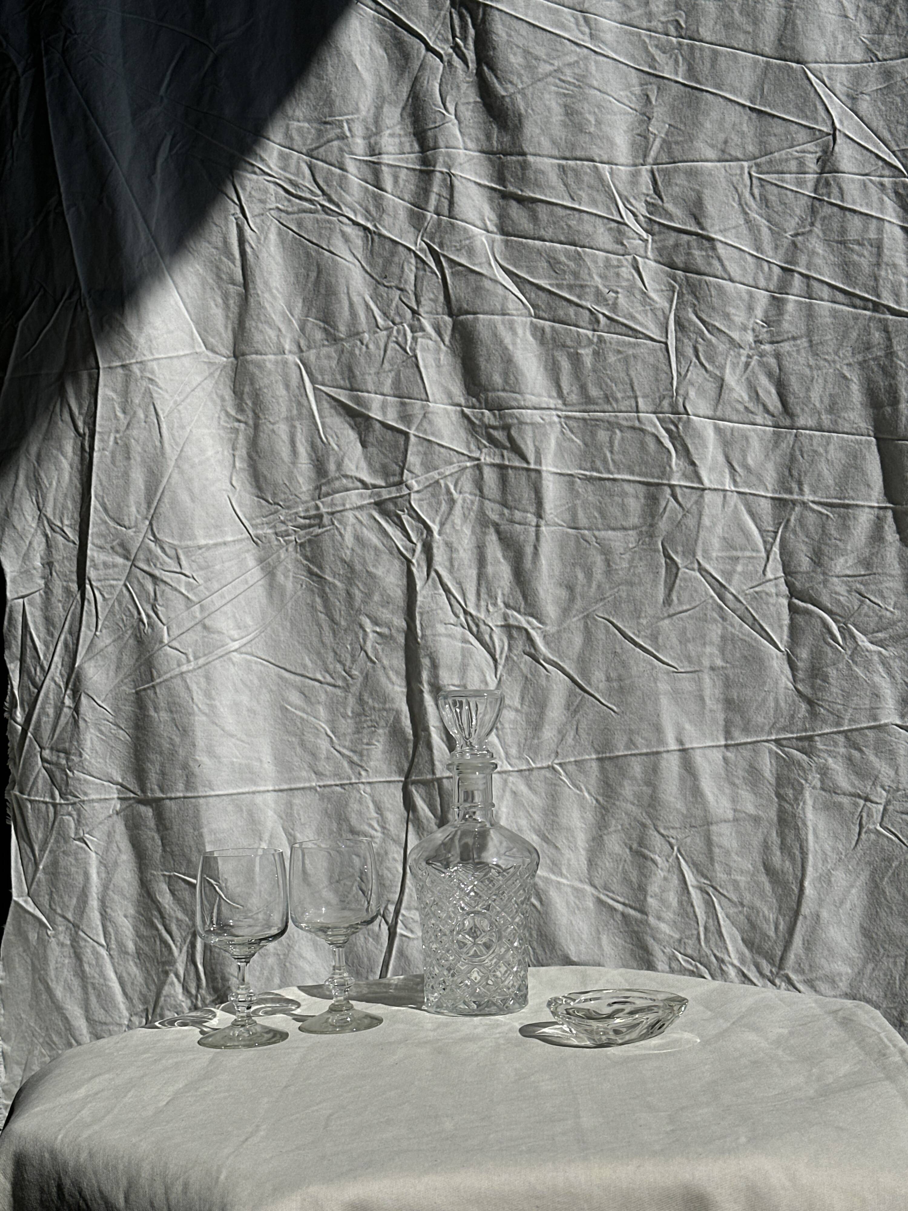 Small cylindrical glass whiskey decanter H:23