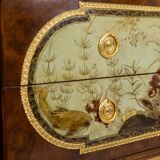 Empire style chest of drawers in lacquer, bronze and marble. Nineteenth century.