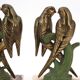 Art Deco pair of bookends with metal parrots and a marble base.