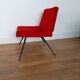 Vintage red faux fur armchair with black metal legs.
