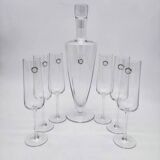 Carafe and 6 stemmed glasses made of Murano glass.