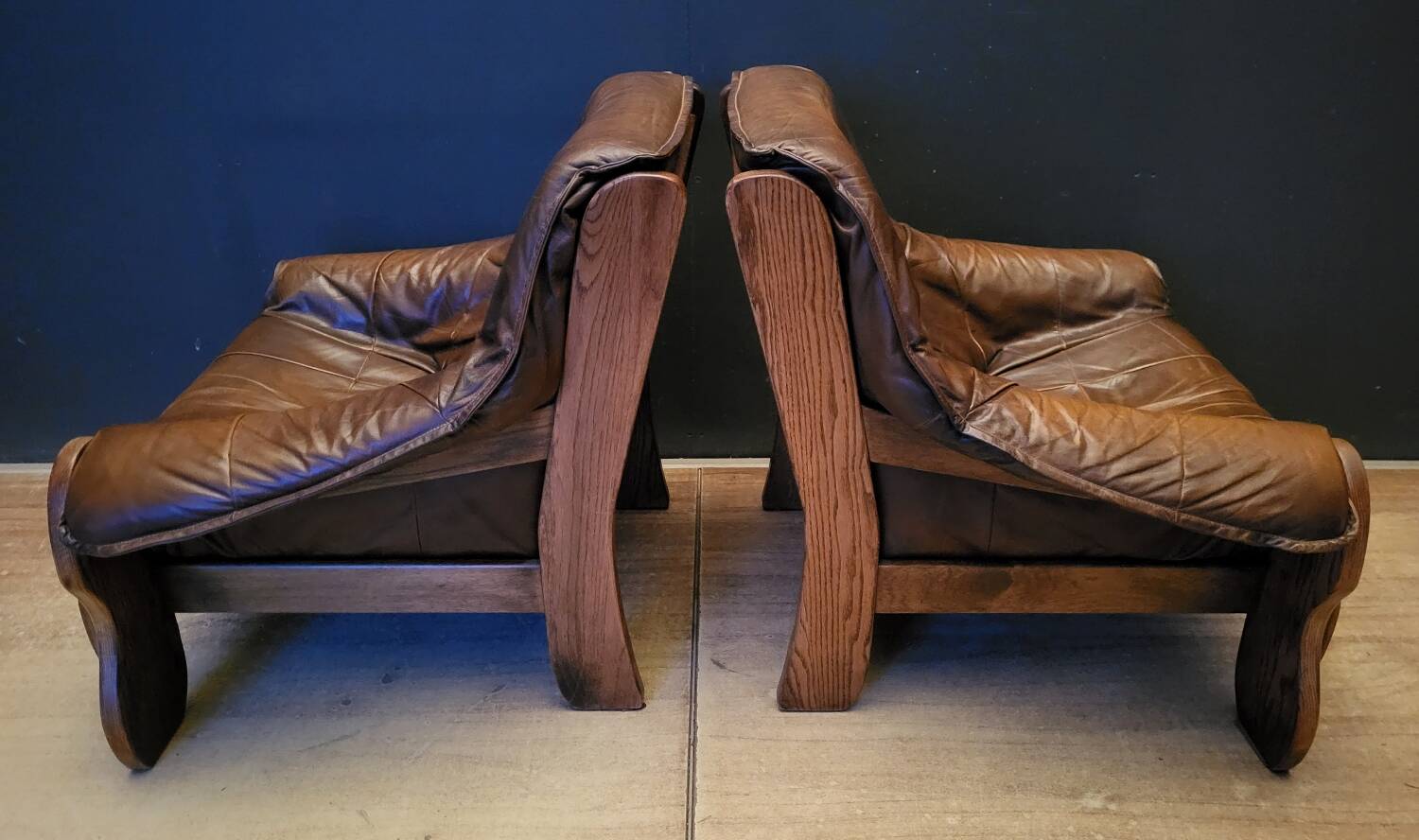 Pair of Vintage Brutalist armchairs from the 60s in leather and solid oak