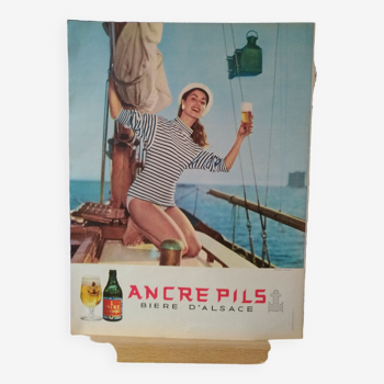 Une publicité papier bière Ancre Pils   voilier &  femme   issue d'une revue d'époque