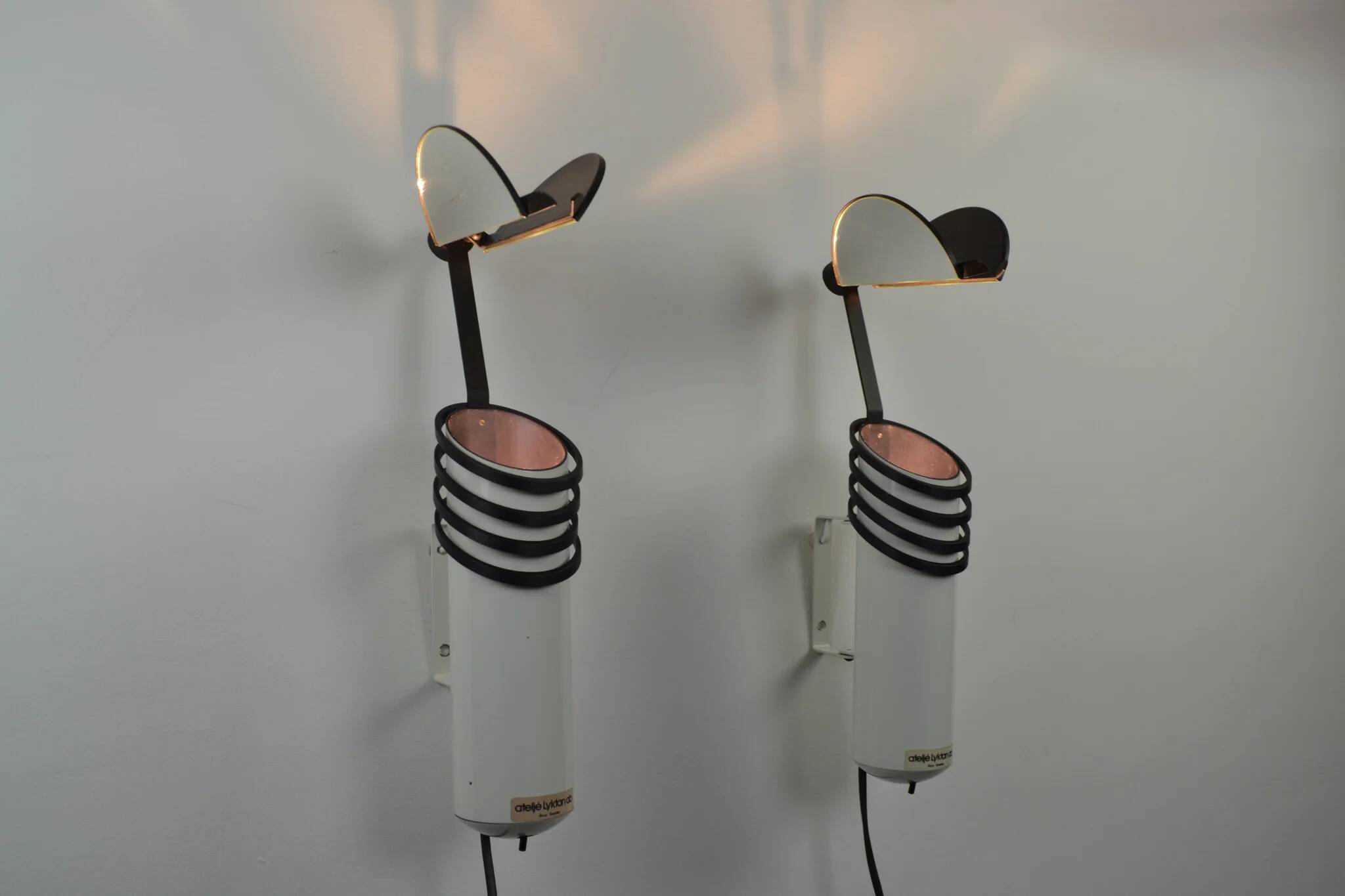 A pair of white “Skarabé” wall lamps by Stig Ahlström and Clas Kock for Ateljé Lyktan, Sweden, 1980s
