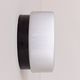 Vintage wall light in black Bakelite and opaline, France 1970.