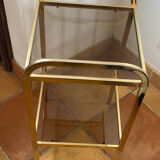 Gold metal and smoked glass console table.
