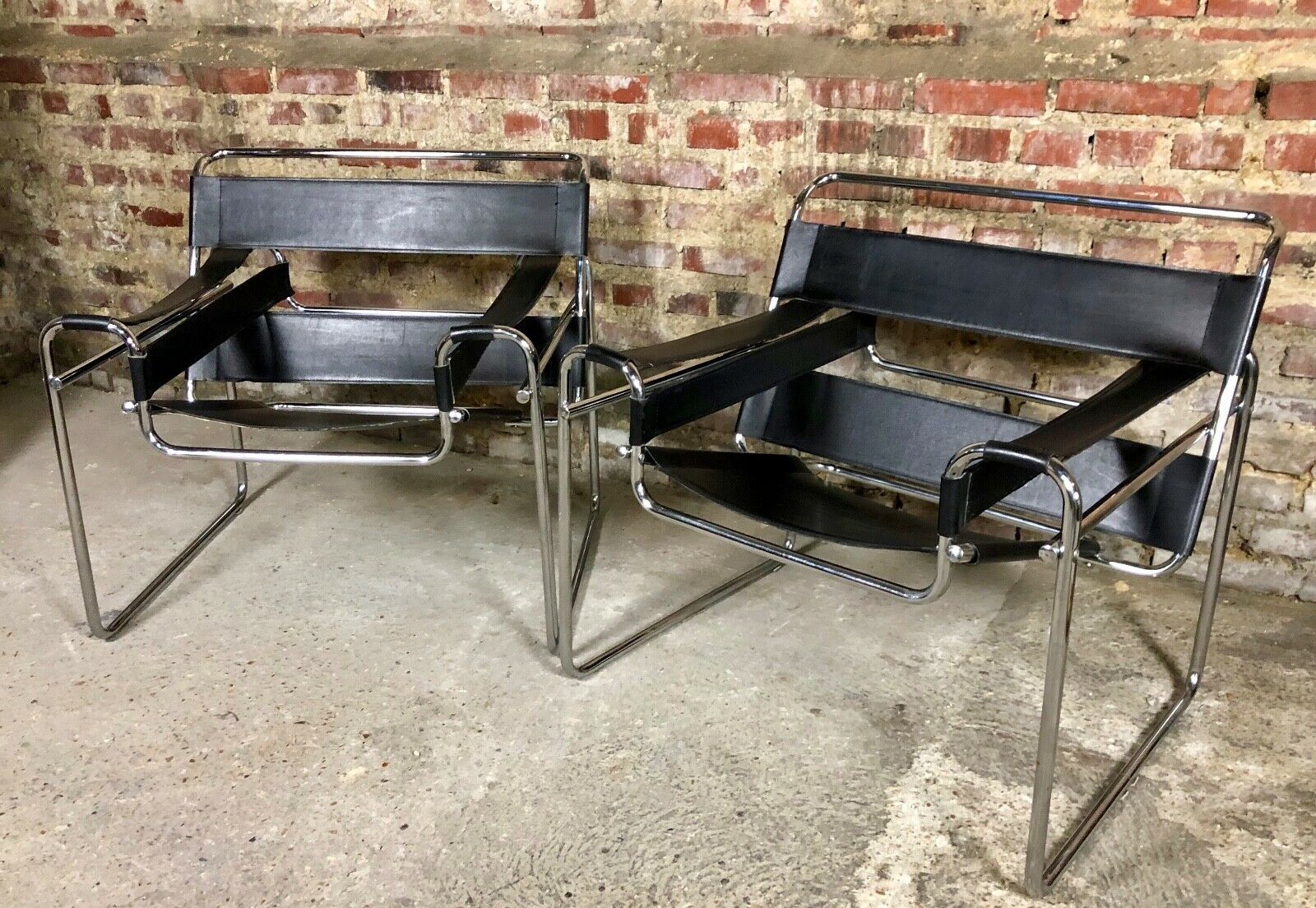 Pair of Marcel Breuer's Wassily armchairs in stainless steel and 60's leather
