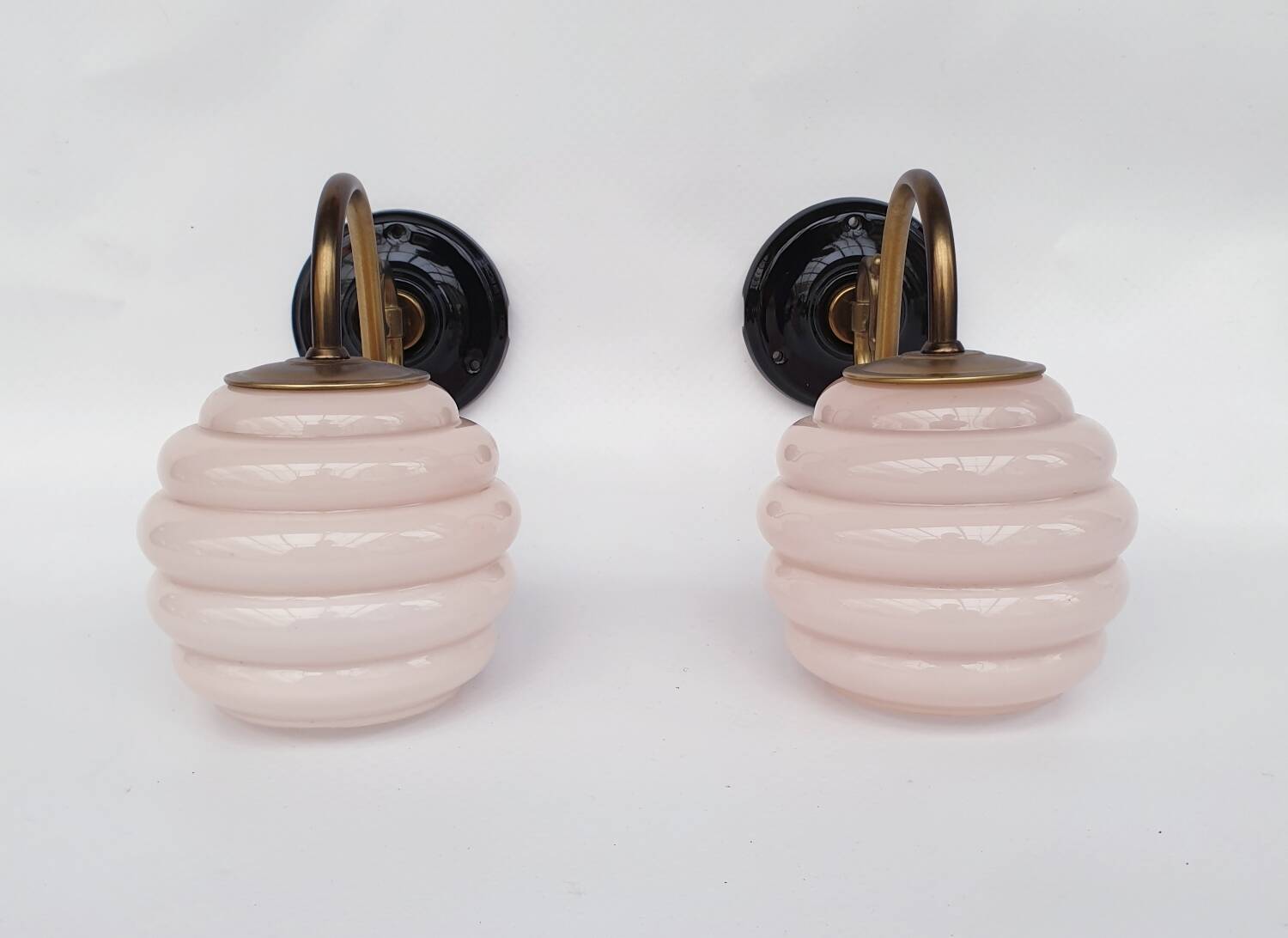 Brass and glass swan neck wall lights