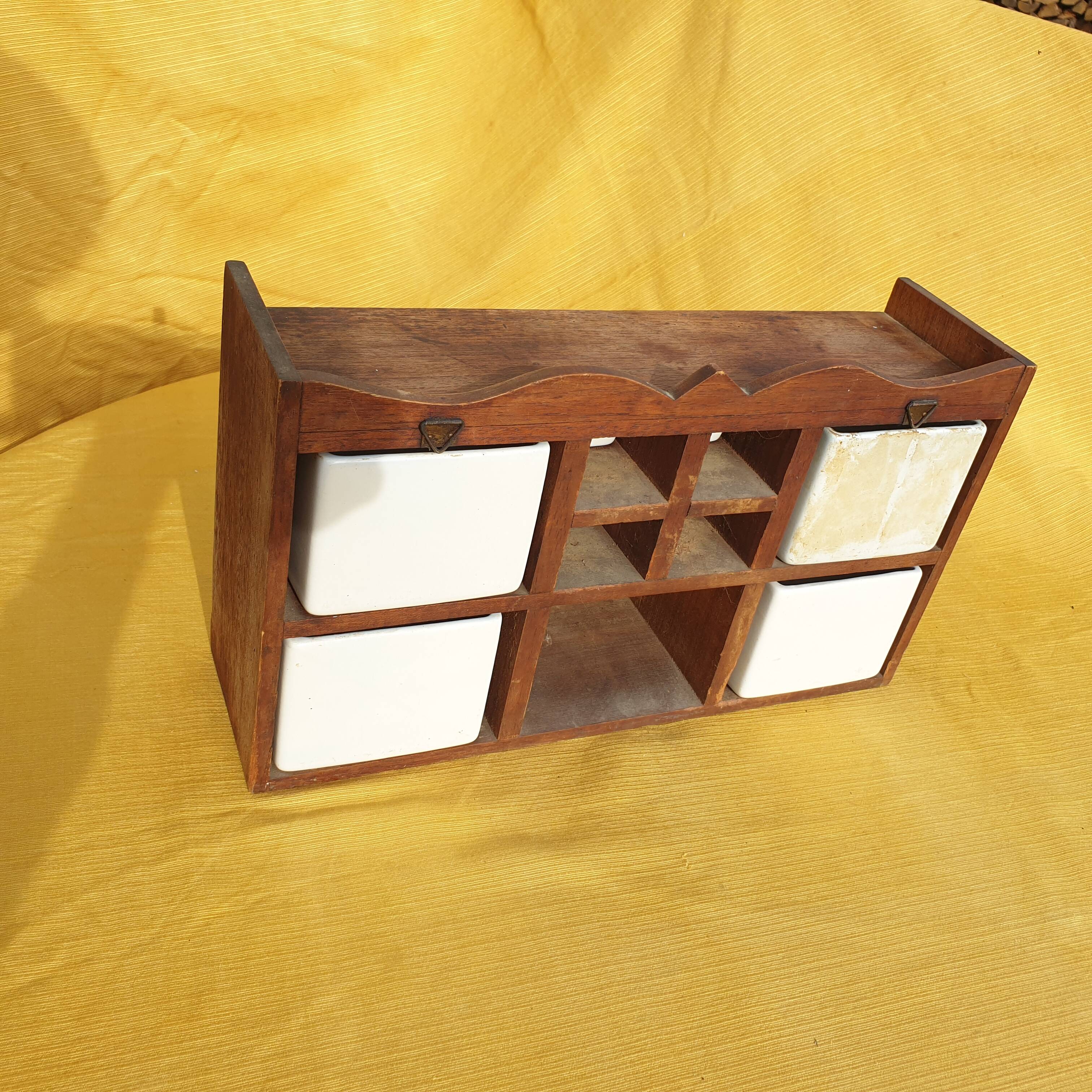 Vintage wooden spice rack with ceramic drawers