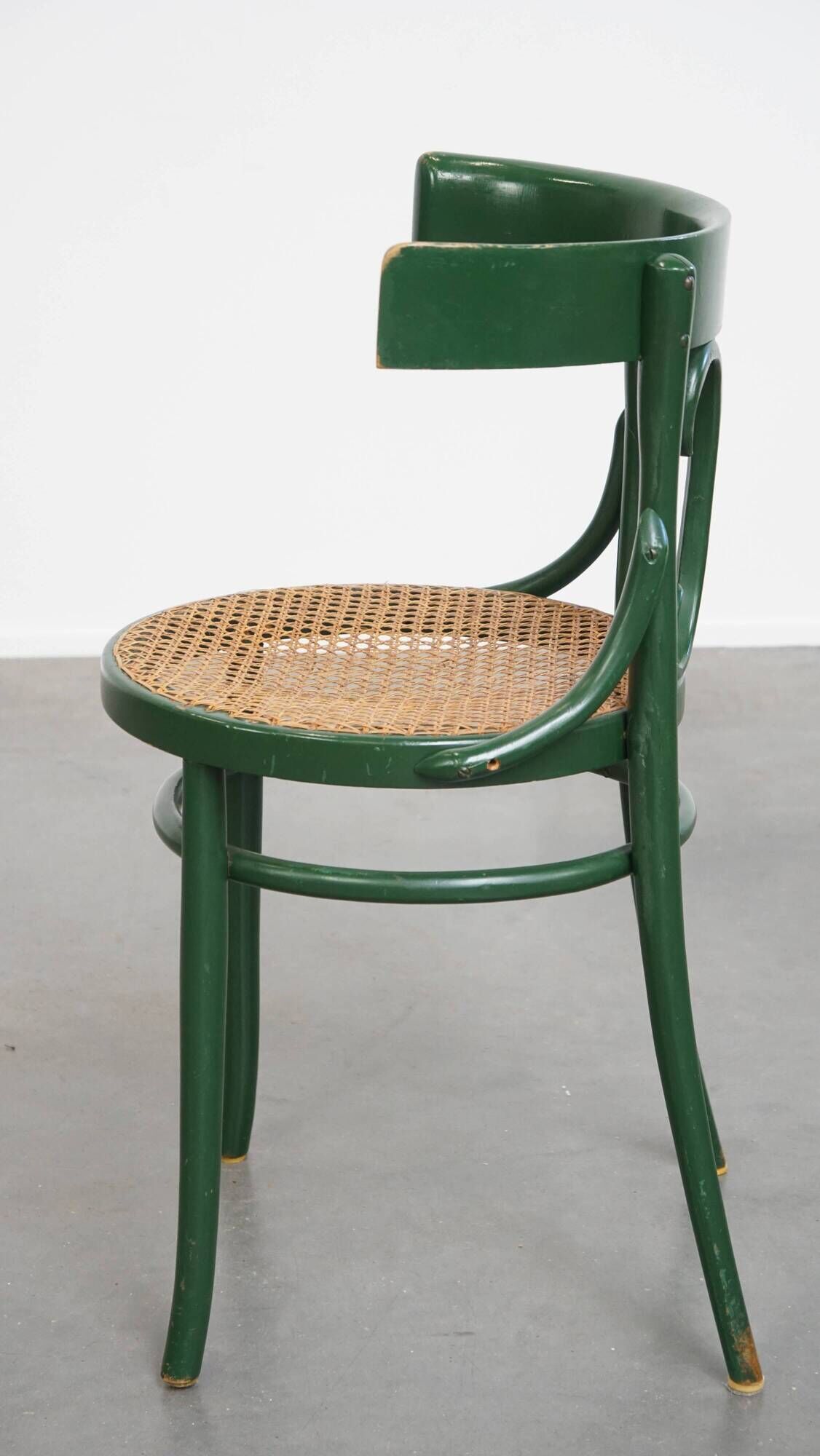 Vintage green bistro chair with woven reed seat