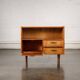 Old TV cabinet with brass handles.