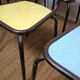 8 canteen chairs, yellow, blue, and red Formica with metal tubing from the 1950s-60s.