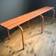 Ancien banc métallique orange