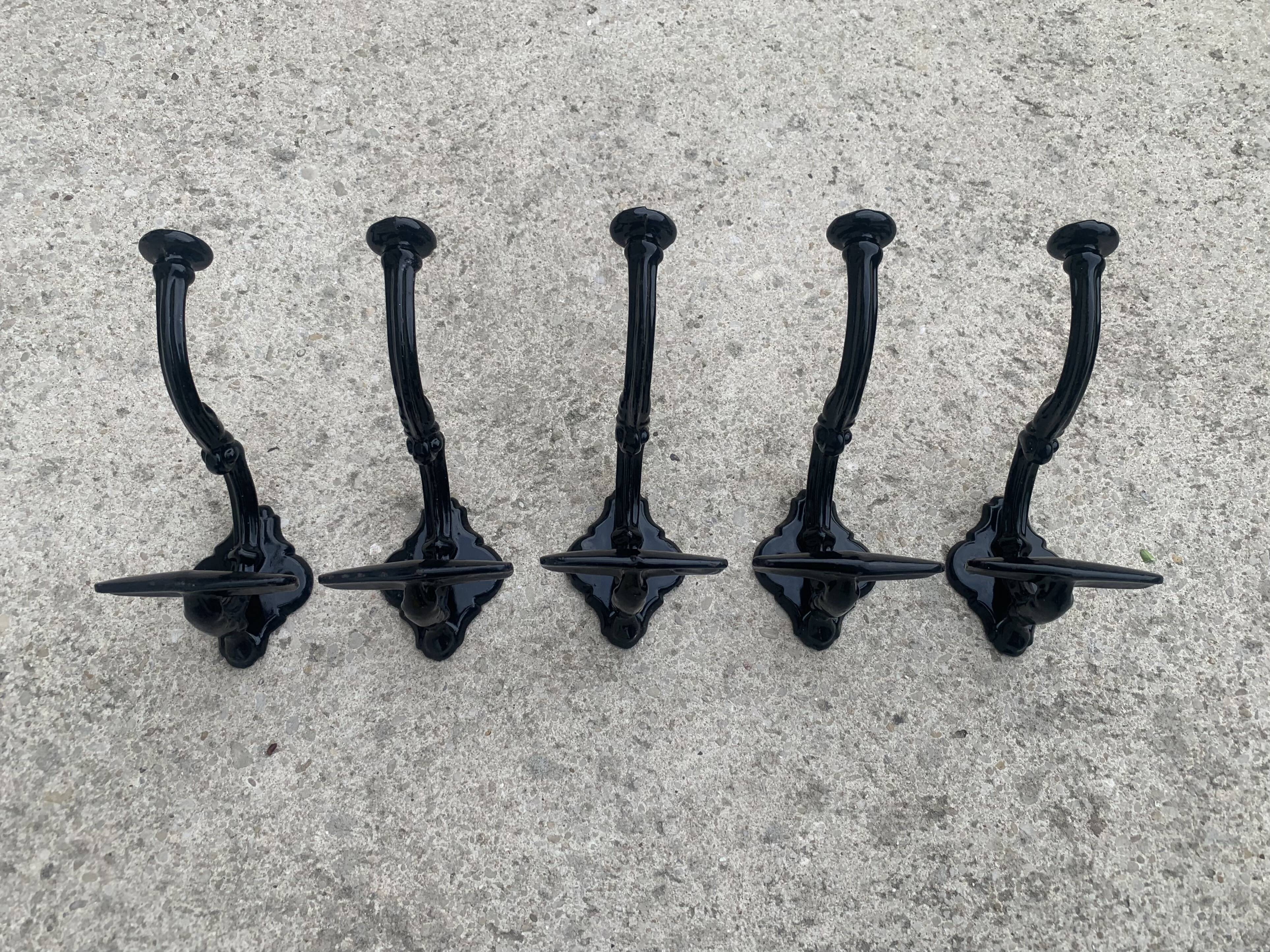 Set of 5 old cast iron hooks