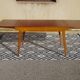Extendable table, compass legs