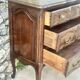Carved and moulded solid wood commode in the Louis XV style.