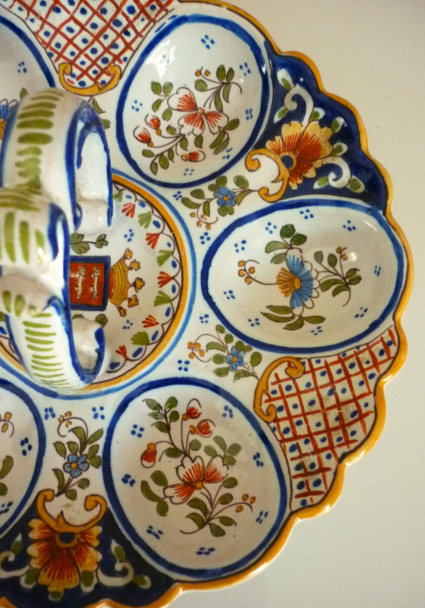 Dish, egg server in hand-painted earthenware, signed Geo Martel