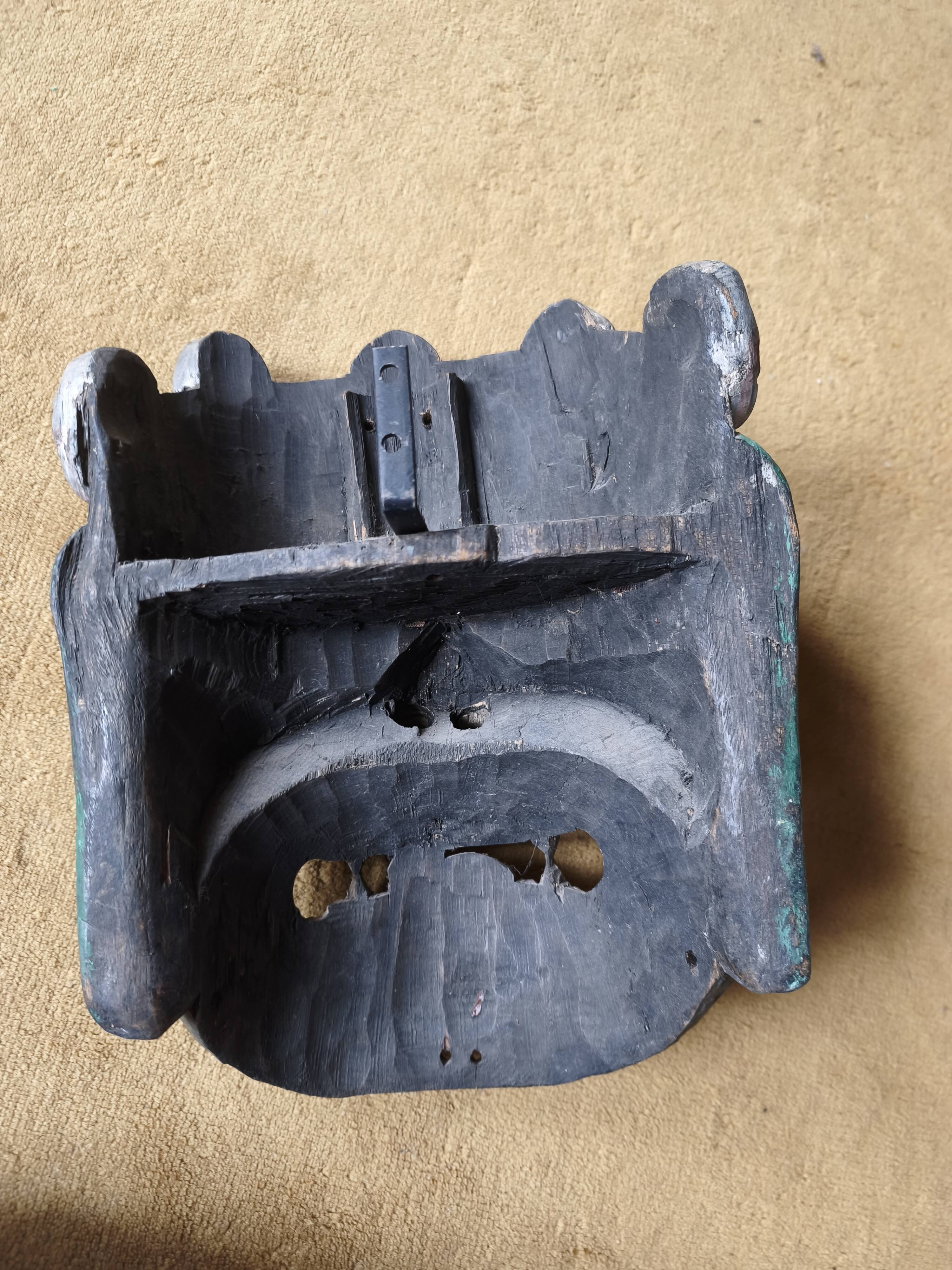 Balinese mask of Bhoma in polychrome carved wood, 20th century.