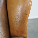 Sheep leather wingback chair with patina
