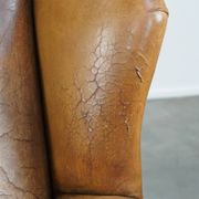 Patinated sheep leather wingback armchair