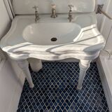 Set of a sink and its retro ceramic splashback.