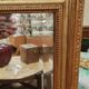 Old beveled mirror with gilded wood frame 20th century
