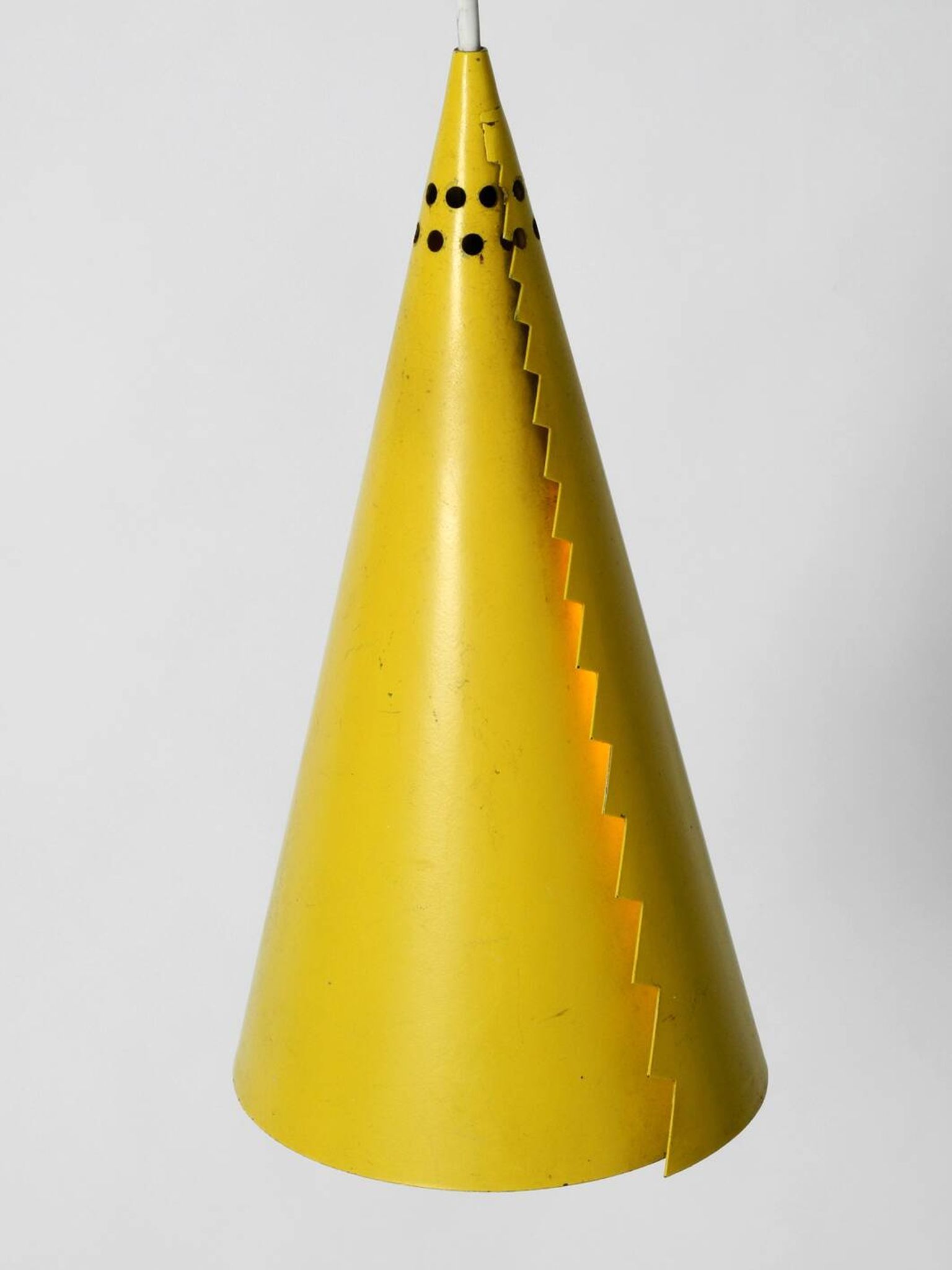 Rare Mid Century Modern cone shaped pendant lamp made of sheet steel in yel