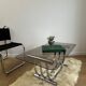 Smoked glass coffee table and chrome base by Yves Boutboul