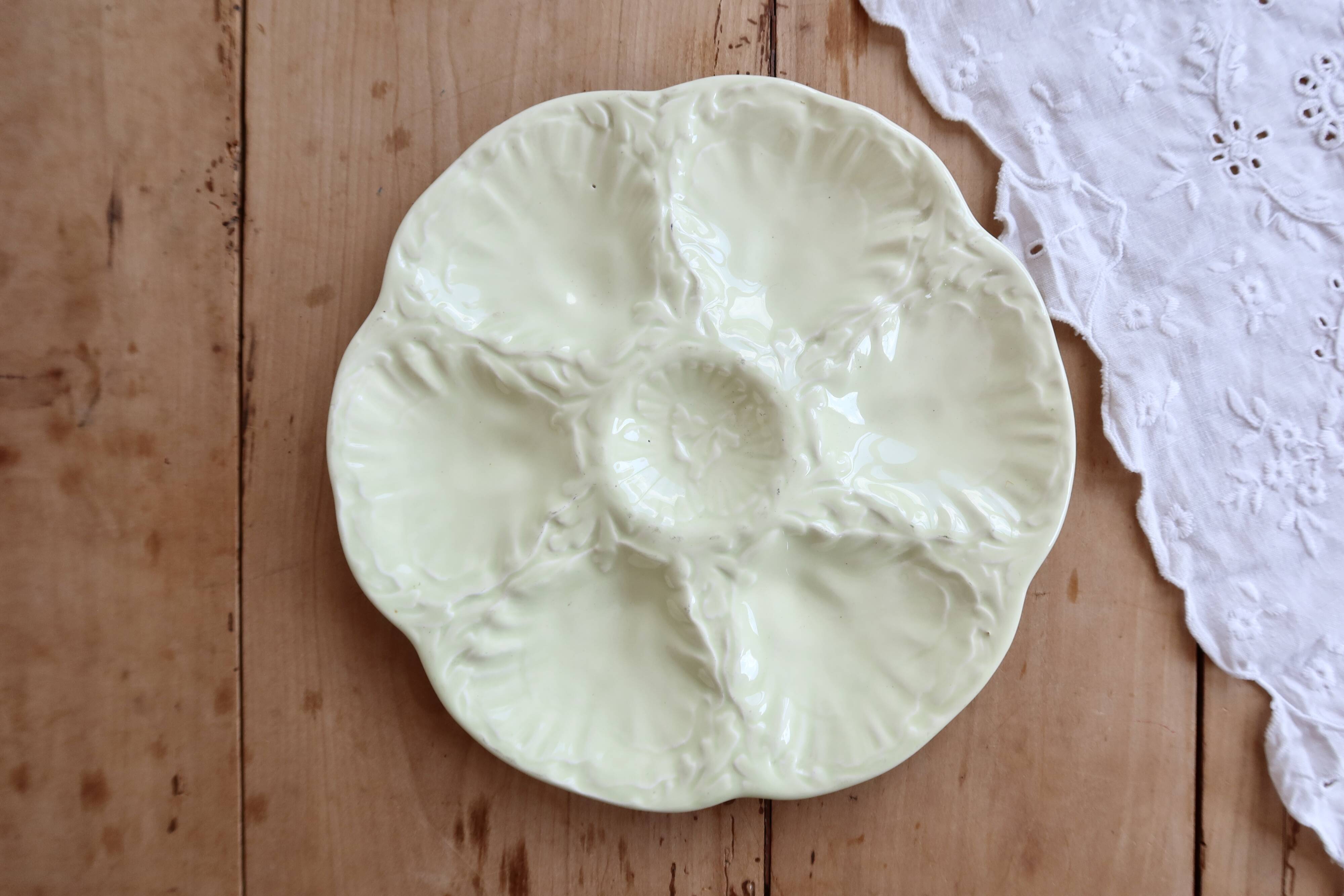 Vintage Gien oyster plate in almond green earthenware.