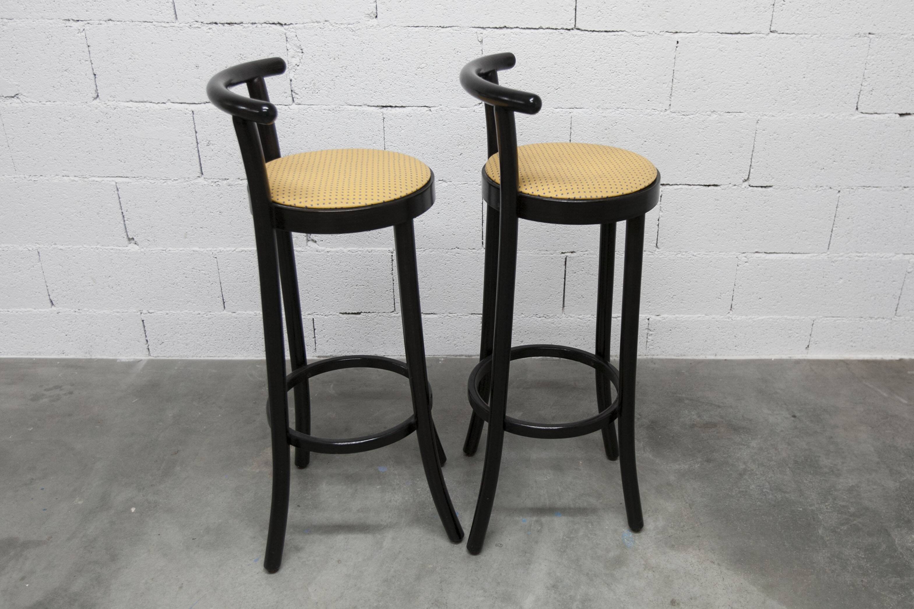 Pair of Baumann stools model Dialog in black and yellow and blue faux leather 1990