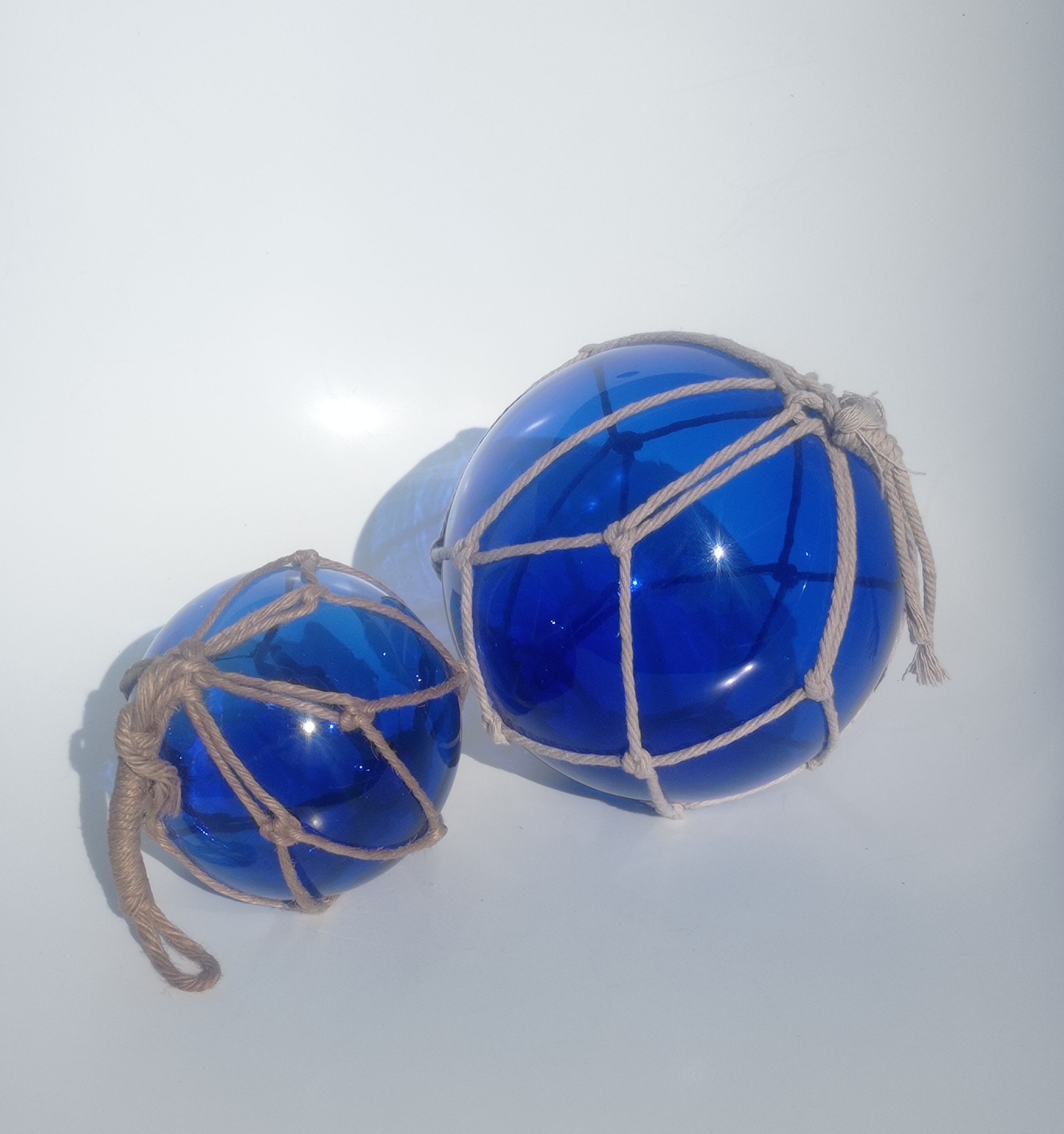 Two blue trawler balls