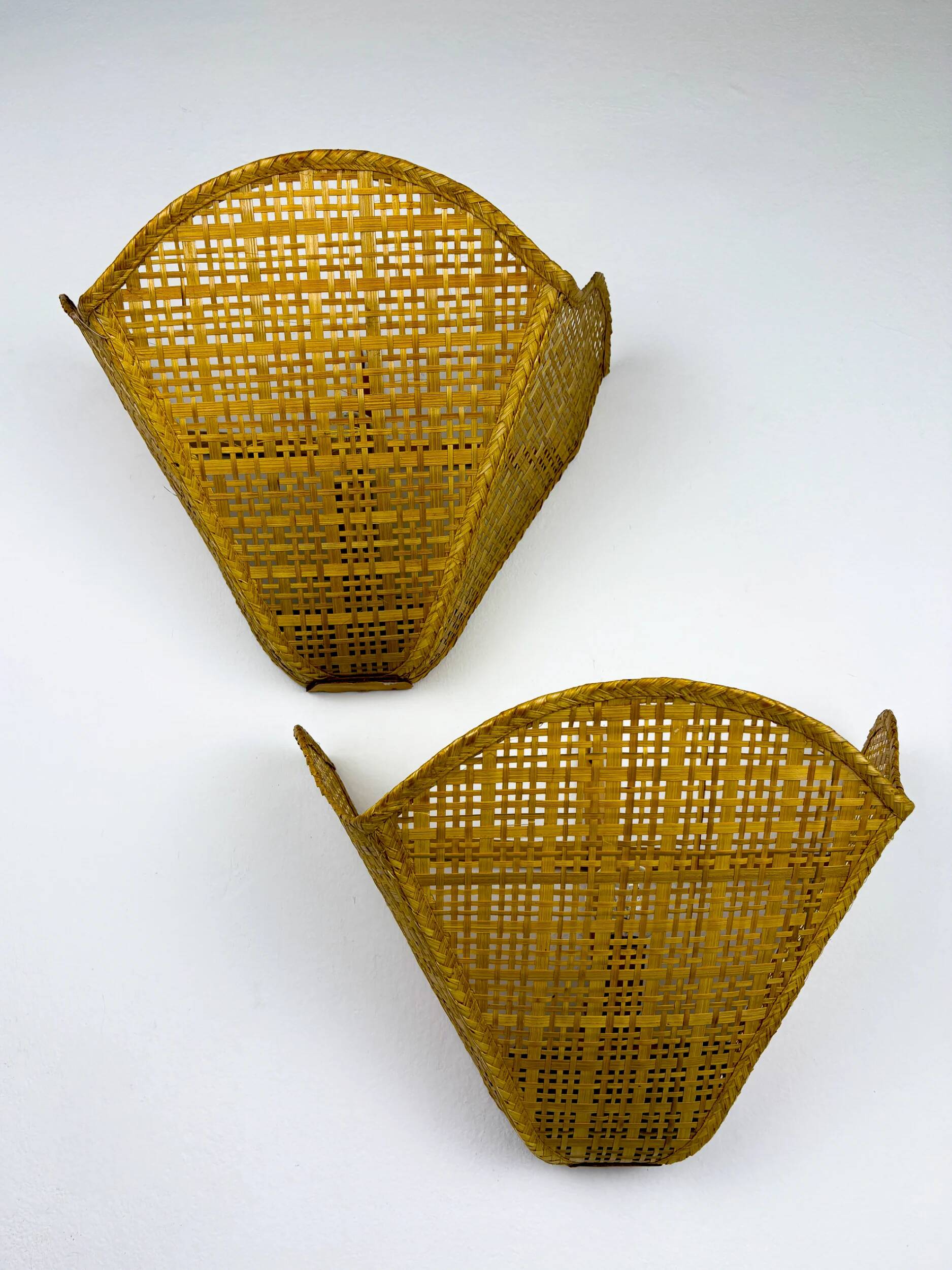 Pair of scalloped rattan wall sconces, sourced in Spain, 1980s