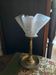 Table lamp with brass fish and draped glass tulip.