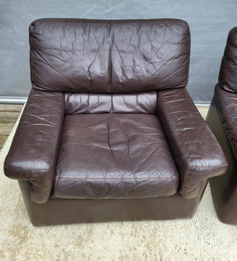 Pair of chocolate leather lounge chairs