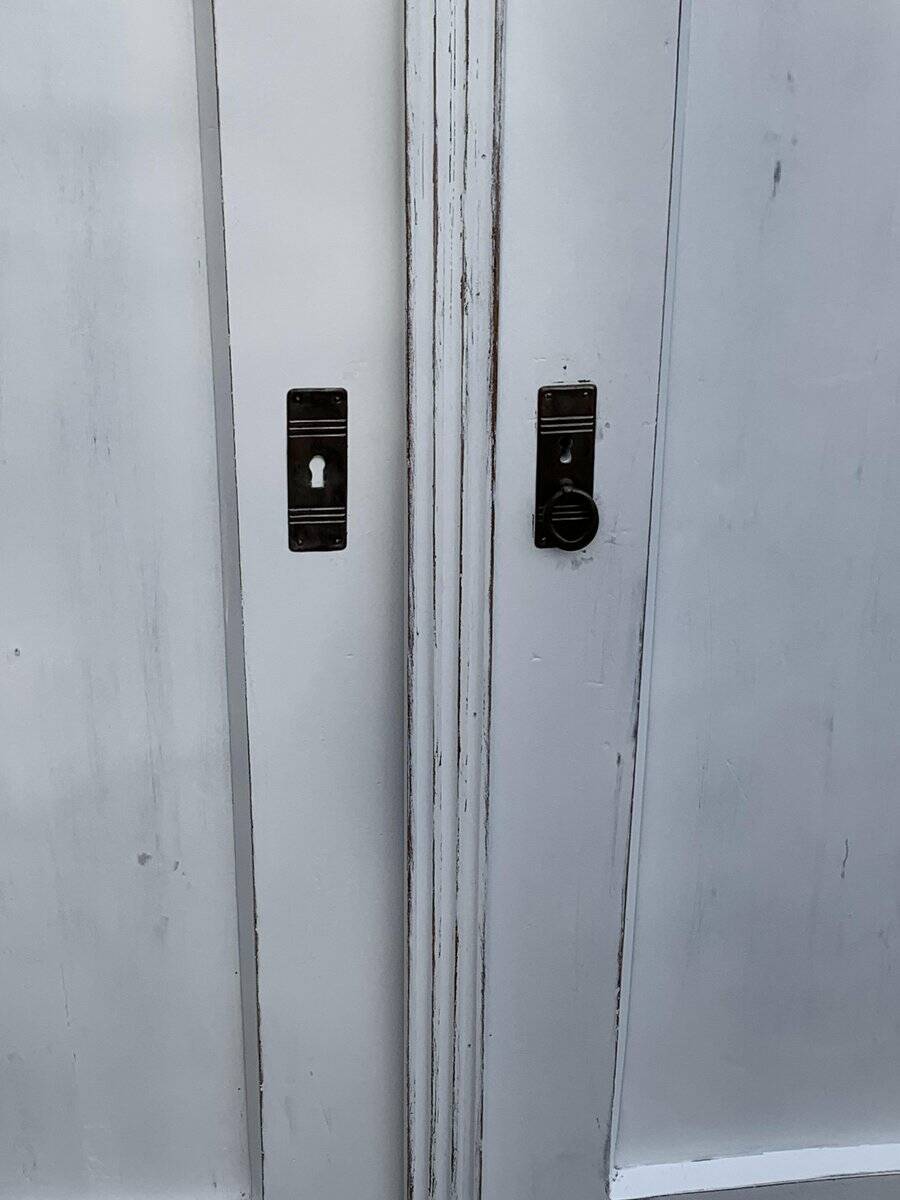 Vintage two-door wardrobe in painted white wood — late 19th century Hungarian style.