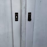 Vintage two-door wardrobe in painted white wood — late 19th century Hungarian style.