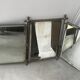 Large and old mirror of tryptic barbier